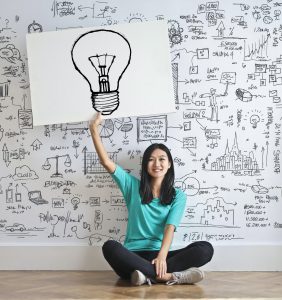 woman with bulb sign